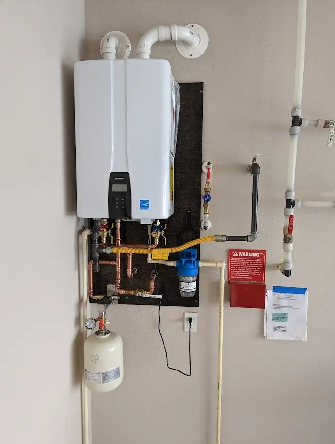 Professional plumber installing copper piping in a South Gate home